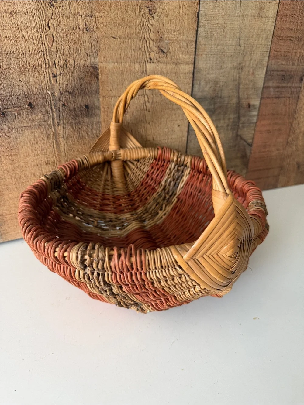 Vintage Primitive Woven Buttocks Basket with God’s Eye in Natural and Terracotta